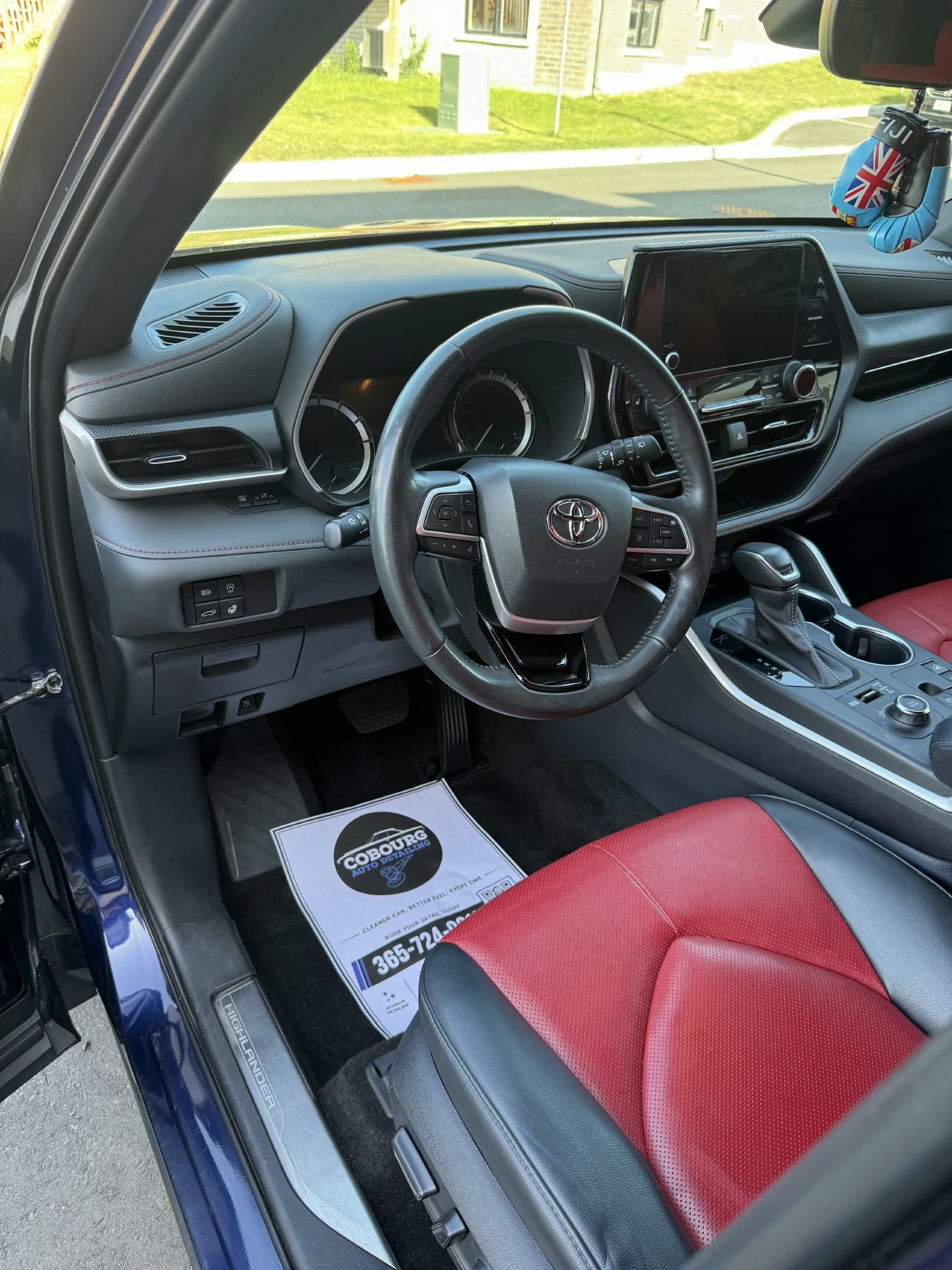 Toyota cabin with red leather seats and a detailed dashboard