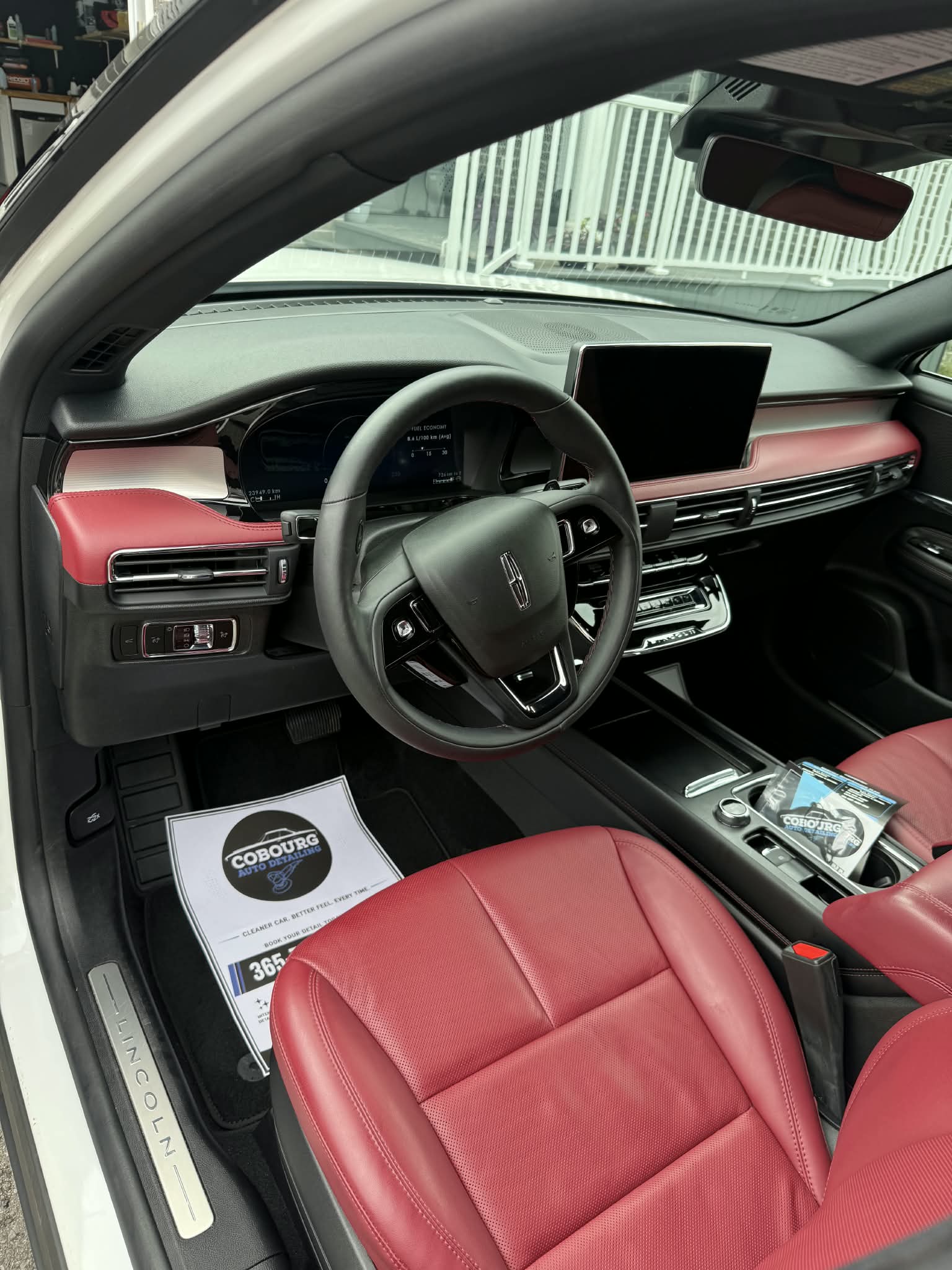 Lincoln cabin with red leather seats and matching dashboard trim