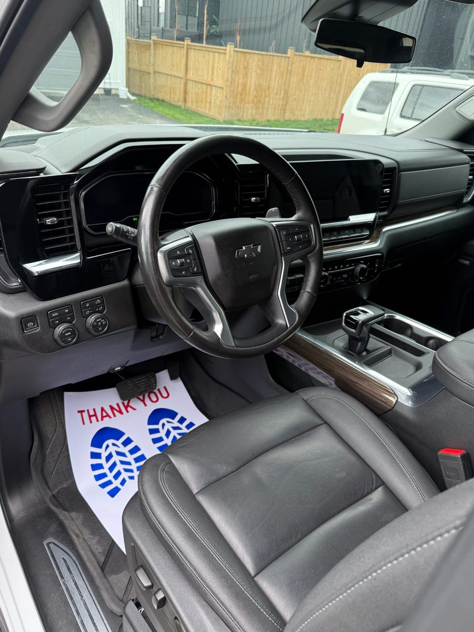 Chevrolet Silverado interior after detailing: clean floor, conditioned leather seats